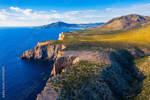 Island of Sardinia, western Mediterranean rugged coast, Italy. Mediterranean island of Sardinia (Sardegna), Italy. Cliffs at the western shore, Sardinia, Italy. photo