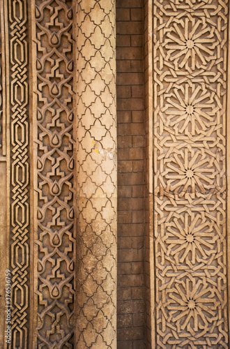 Arabic pattern in stone, architecture detail of arch. Morrocan handcraft, exterior of building geometric ornaments. 