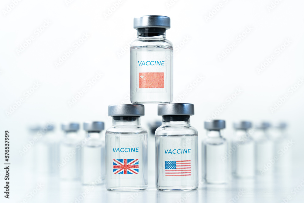 Transparent vials with USA, UK, China flag. New vaccine for covid-19 coronavirus, flu,infectious diseases. Injection after clinical trials for mass vaccination of human,people. Medicine, drug concept Transparent vials with USA, UK, China flag. New vaccine for covid-19 coronavirus, flu,infectious diseases. Injection after clinical trials for mass vaccination of human,people. Medicine, drug concept