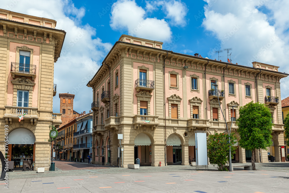Buildings on small square in town of Alba, Italy. - obrazy, fototapety, plakaty 