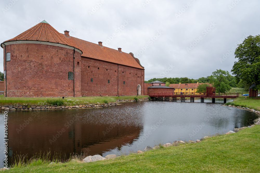 The moat and the western facade of Landskrona castle on a grey day in Skåne, Sweden
