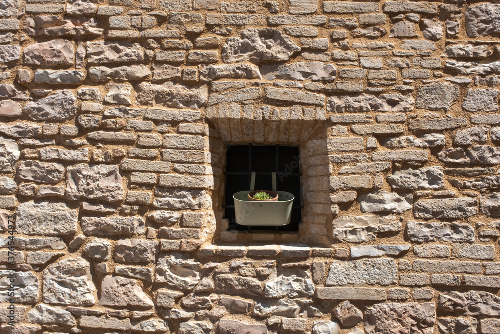 Italian Window with Wooden Shutters in a brick wall Italian Window with Wooden Shutters in a brick wall