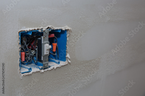 3-Gang Blue Plastic Switch Outlet Electical Box on unfinihsed walll