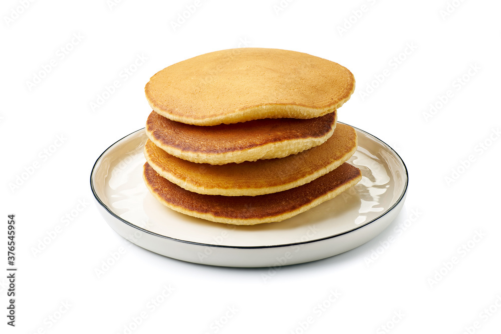 Dish with stacked pancakes on white Dish with stacked pancakes on white