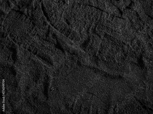 A close up of a black coal texture, dark coal background