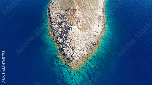 Aerial drone photo of iconic lighthouse in scenic Cape Matapan or Tainaron the Southest part of mainland Greece, Mani, Peloponnese, Greece