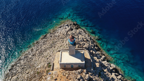Aerial drone photo of iconic lighthouse in scenic Cape Matapan or Tainaron the Southest part of mainland Greece, Mani, Peloponnese, Greece photo