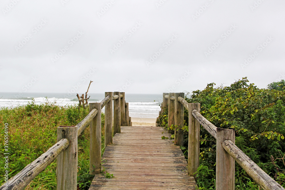 wooden bridge on beach
