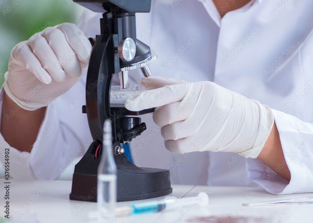 Female scientist researcher conducting an experiment in a labora