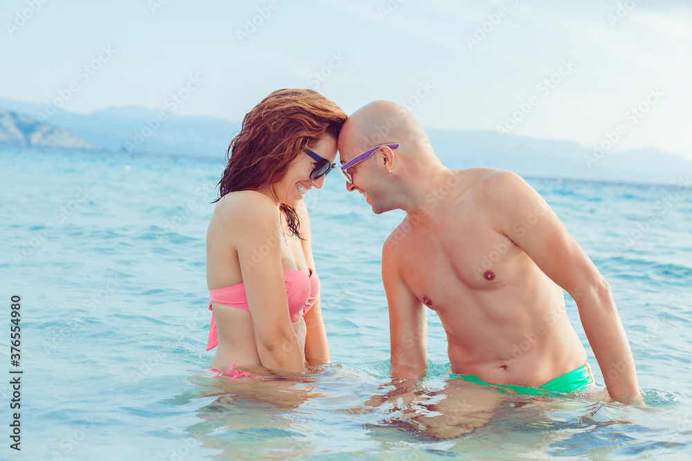 Happy Romantic Couple playing in the water Happy Romantic Couple playing in the water