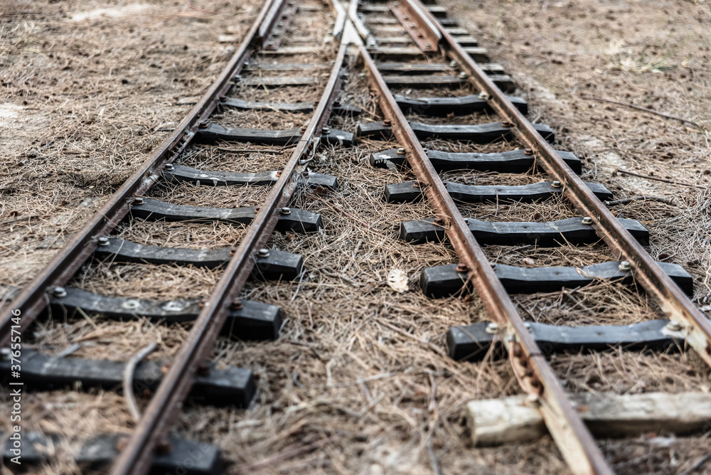 Old train track with rails branching off in two different directions. Old train track with rails branching off in two different directions.