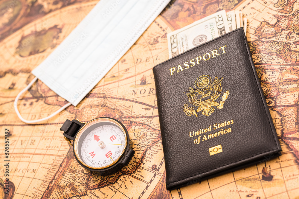 American passport in patriotic background for travelers with a mask. American passport in patriotic background for travelers with a mask.