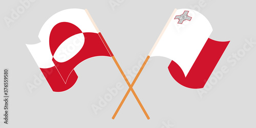 Crossed and waving flags of Greenland and Malta