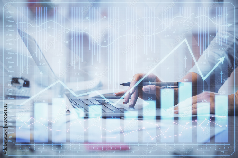 Double exposure of woman hands typing on computer and forex chart hologram drawing. Stock market invest concept. Double exposure of woman hands typing on computer and forex chart hologram drawing. Stock market invest concept.