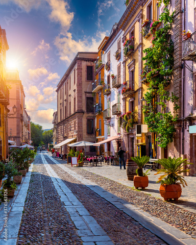 Aerial view of the beautiful village of Bosa with colored houses and a medieval castle. Bosa is located in the north-wesh of Sardinia, Italy. Aerial view of colorful houses in Bosa village, Sardegna.