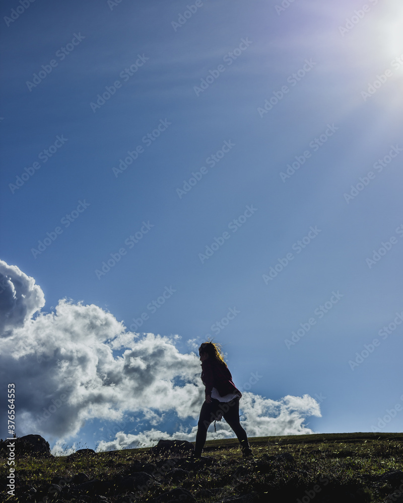 Girl hiking in the hills