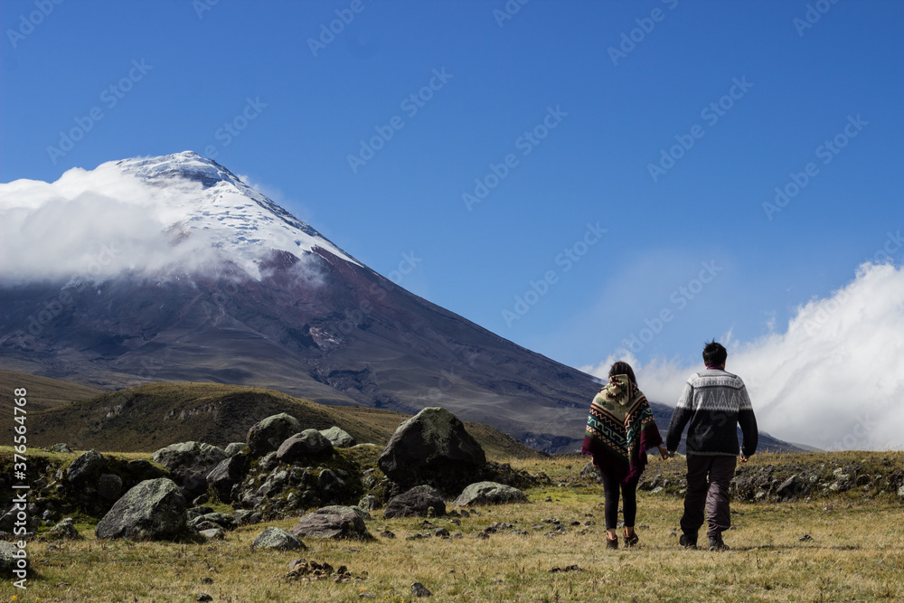 Beautiful couple walking to the mountain