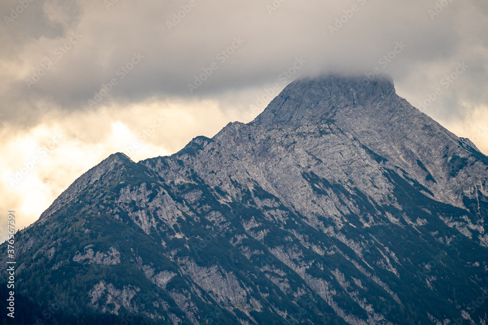 mountain panorama of the karwendel mountains with clouds photo taken at the barmsee