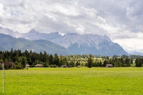 mountain panorama of the karwendel mountains with clouds photo taken at the barmsee