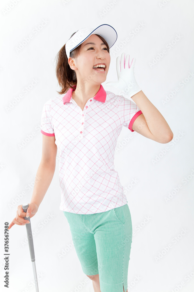 ゴルフをする女性 ゴルフをする女性