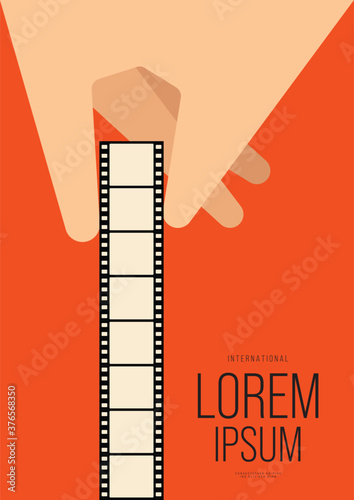 Movie and film poster design template background with human hand holding filmstrip