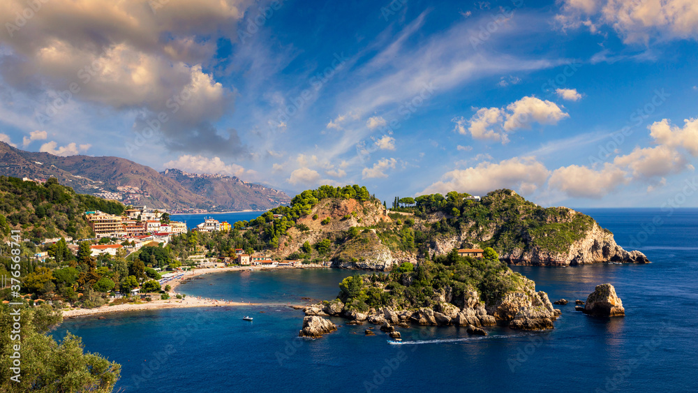 Aerial view of Isola Bella in Taormina, Sicily, Italy. Isola Bella is small island near Taormina, Sicily, Italy. Narrow path connects island to mainland Taormina beach in azure waters of Ionian Sea.