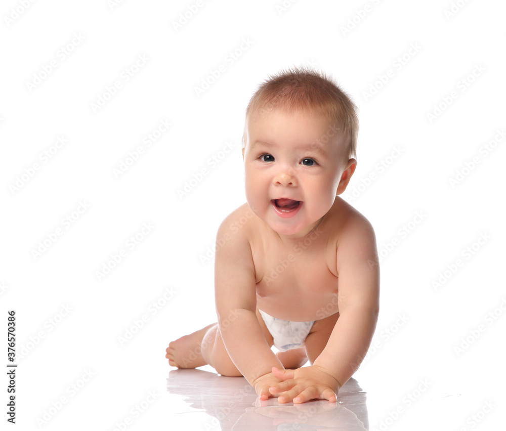 Cute little baby with evil smile crawling on floor Cute little baby with evil smile crawling on floor