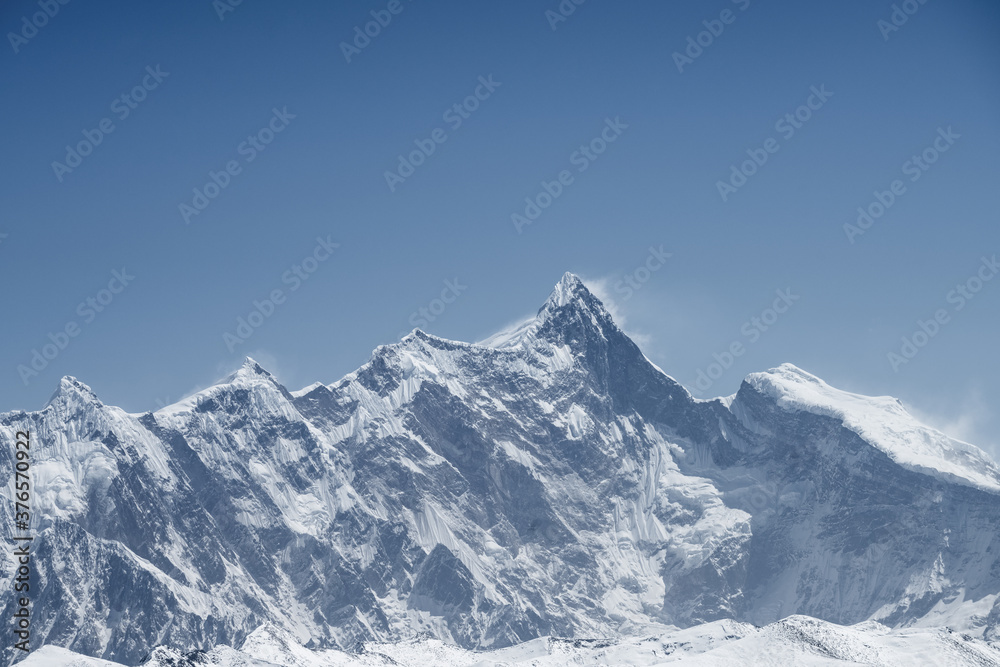 mountain peak against a blue sky