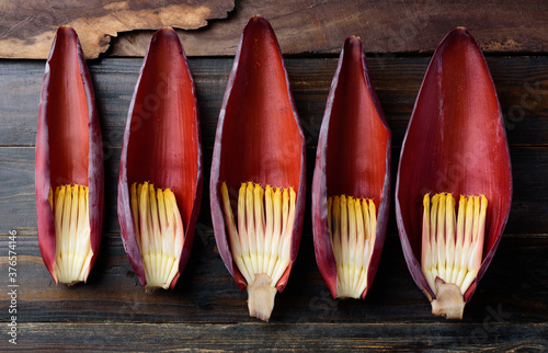 Banana flowers petal on wooden background, Edible plant in Southeast Asian cuisine, food ingredients in salad, curry or soup