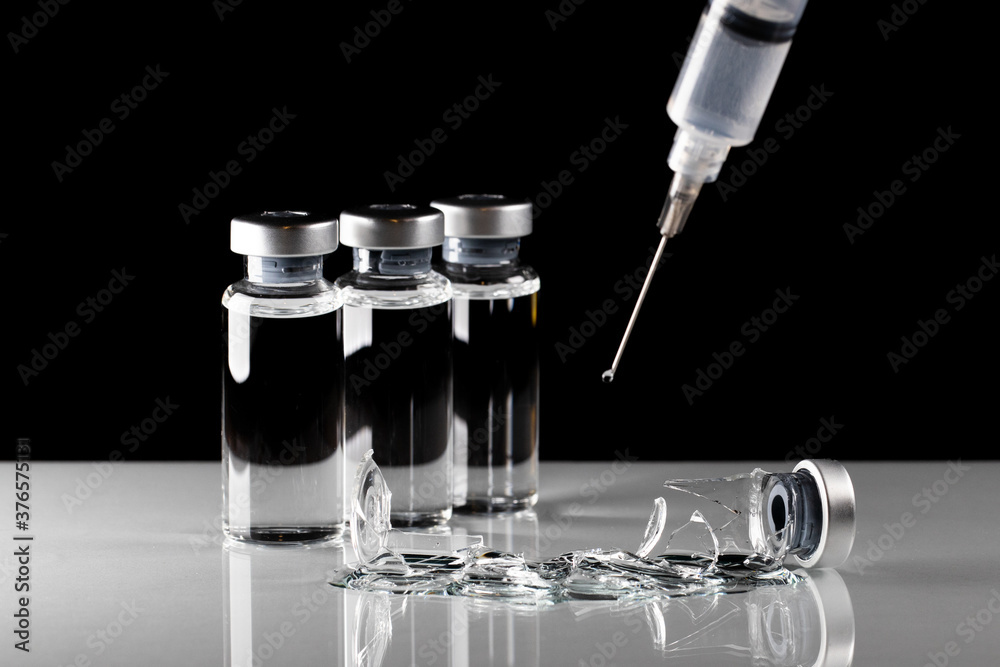 broken vaccine bottle expressing a possible failure of covid vaccine broken vaccine bottle expressing a possible failure of covid vaccine