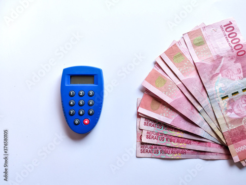 Blue security key bank token and money on white background photo