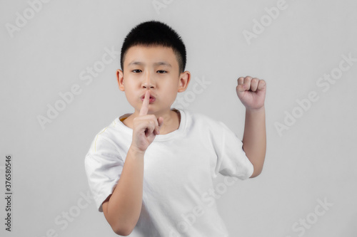 Asian boys studio portrait on gray background