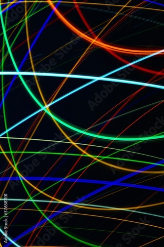 Abstract colorful background with minimalist light traces produced by slow shutter speed