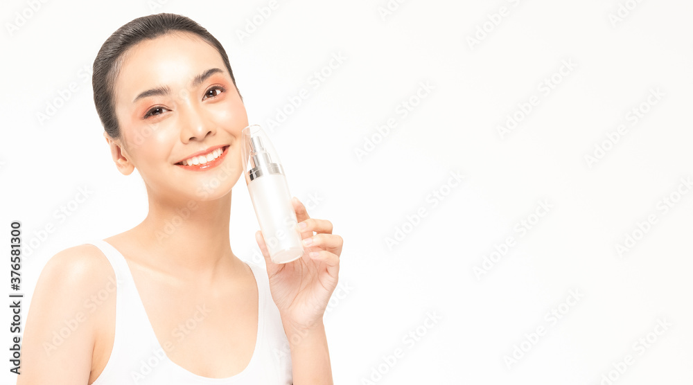 Beauty asian woman hold bottle cosmetic cream lotion and cheerful. Beauty asian woman hold bottle cosmetic cream lotion and cheerful.