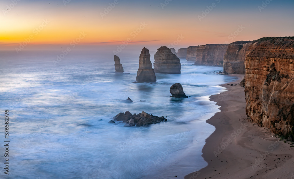 Sunset at the magnificent 12 Apostles, a series of
 limestone stacks off the shore of Port Campbell National Park, by the Great Ocean Road in Victoria, Australia