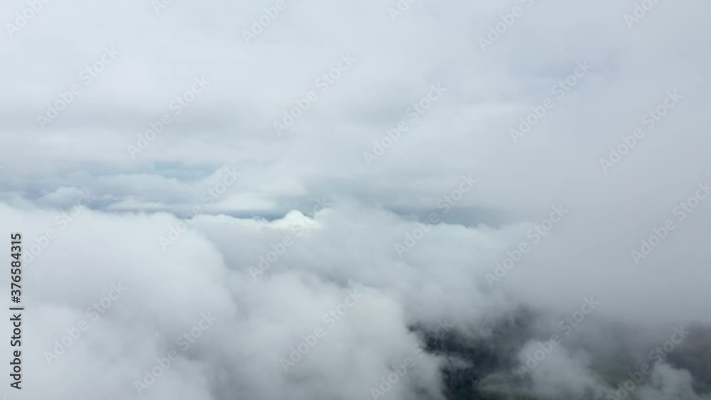 Clouds over countryside and green mountains in Asia, Laos, Khammouane, towards Thakek, on a cloudy day. Clouds over countryside and green mountains in Asia, Laos, Khammouane, towards Thakek, on a cloudy day.
