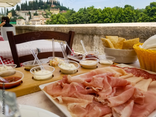 Home-made Tigelle and fried gnocco with cured meats and sauces at Tigella Bella in Verona