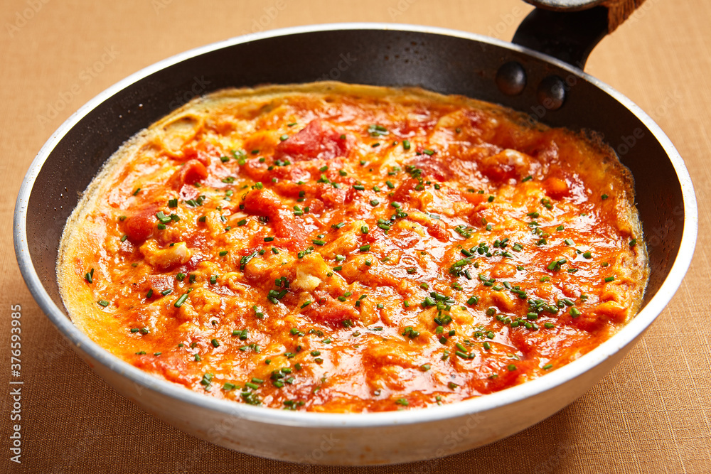 Omelette with tomatoes and seasoning Omelette with tomatoes and seasoning
