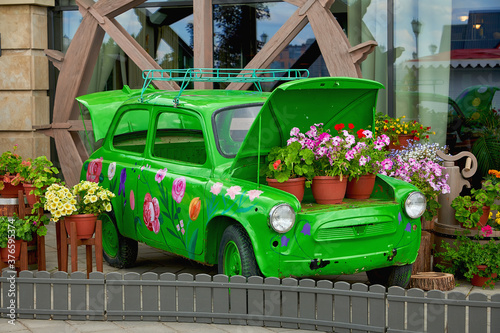 Russia, Kazan June 2019. Flowerbed with flowers in the form of an old car.