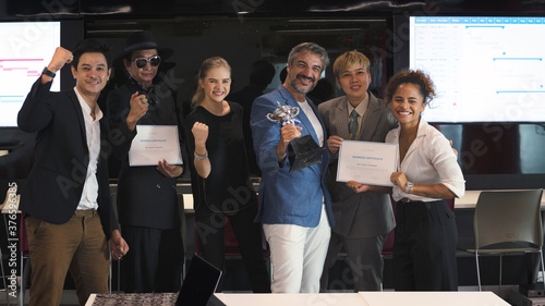 Group of business people with diverse genders (LGBT) celebrate business successful achievement award ceremony in the meeting room at office workplace