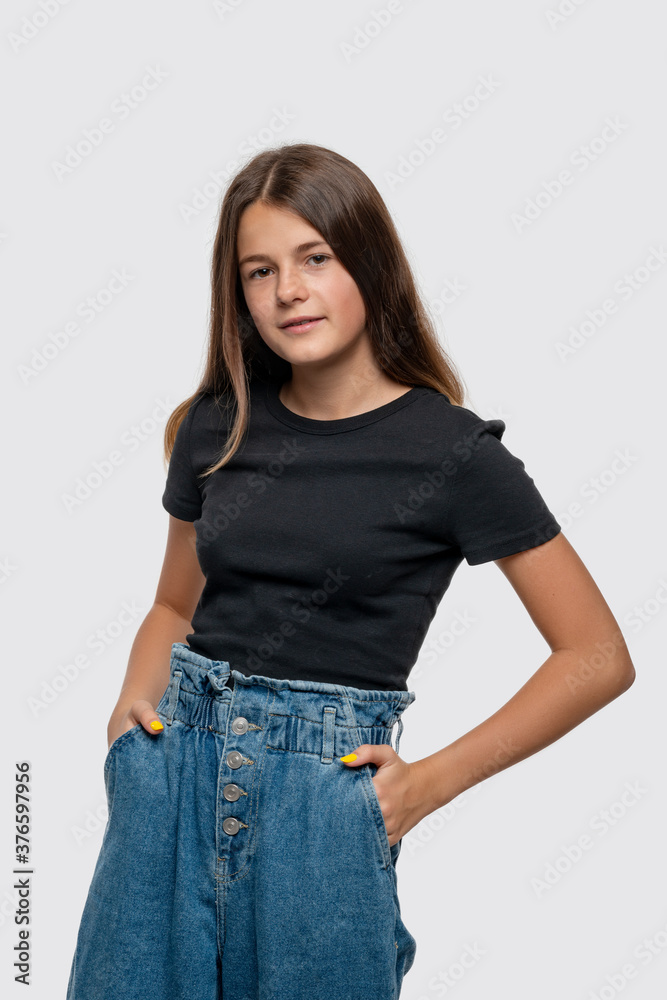 Obraz premium Studio shot of young smiling teenager girl, isolated