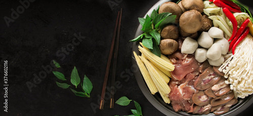 Japanese Sukiyaki in traditional Cast Iron Pot. Chabu sukiyaki, Japanese food. photo