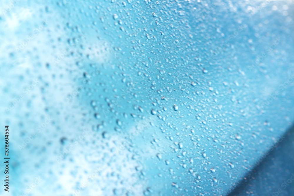 Obraz premium Rain texture drops on blue background