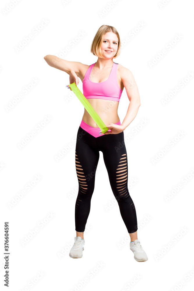 Young Fitness woman in training dress, with green rubber band. Isolate white background. Young Fitness woman in training dress, with green rubber band. Isolate white background.