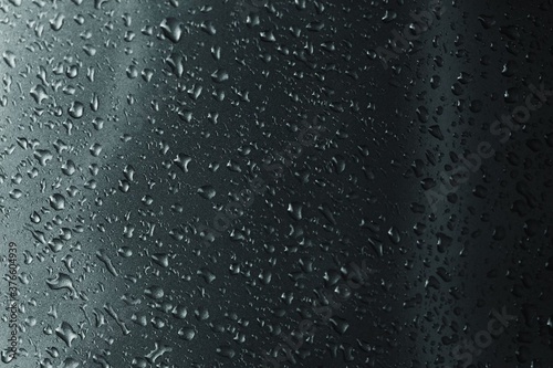 Rain drops on a gray background.