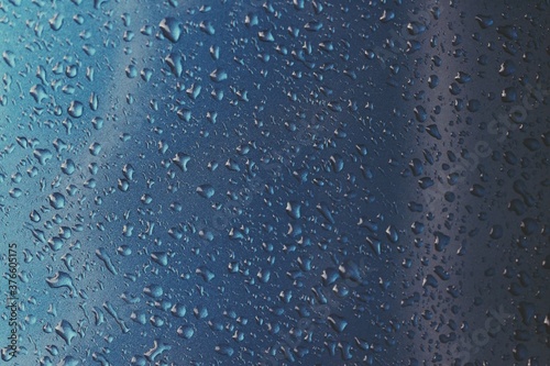 Rain texture drops on blue background