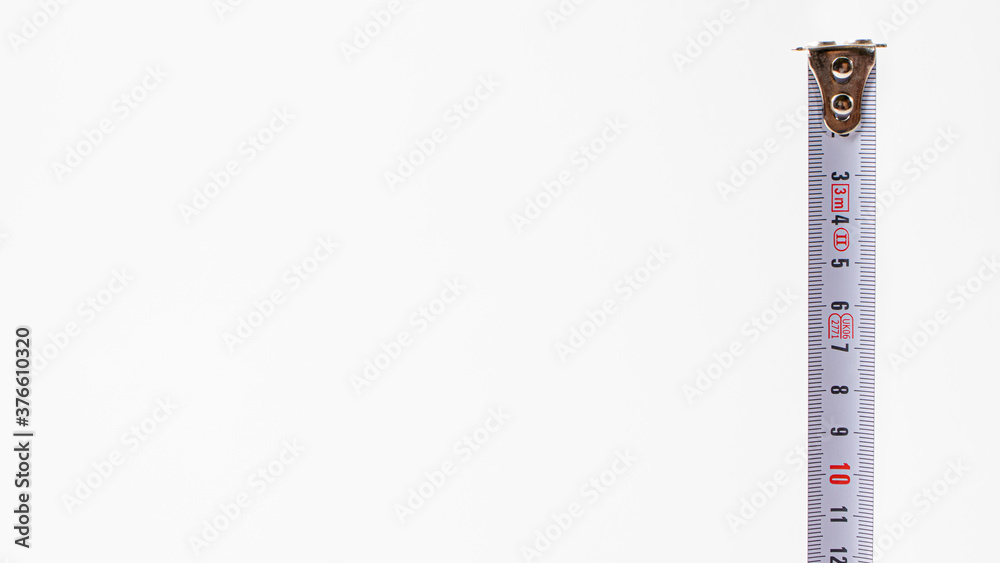 Measuring tape with numbers centimeters on a white background. Construction tools. Banner with place for text Measuring tape with numbers centimeters on a white background. Construction tools. Banner with place for text