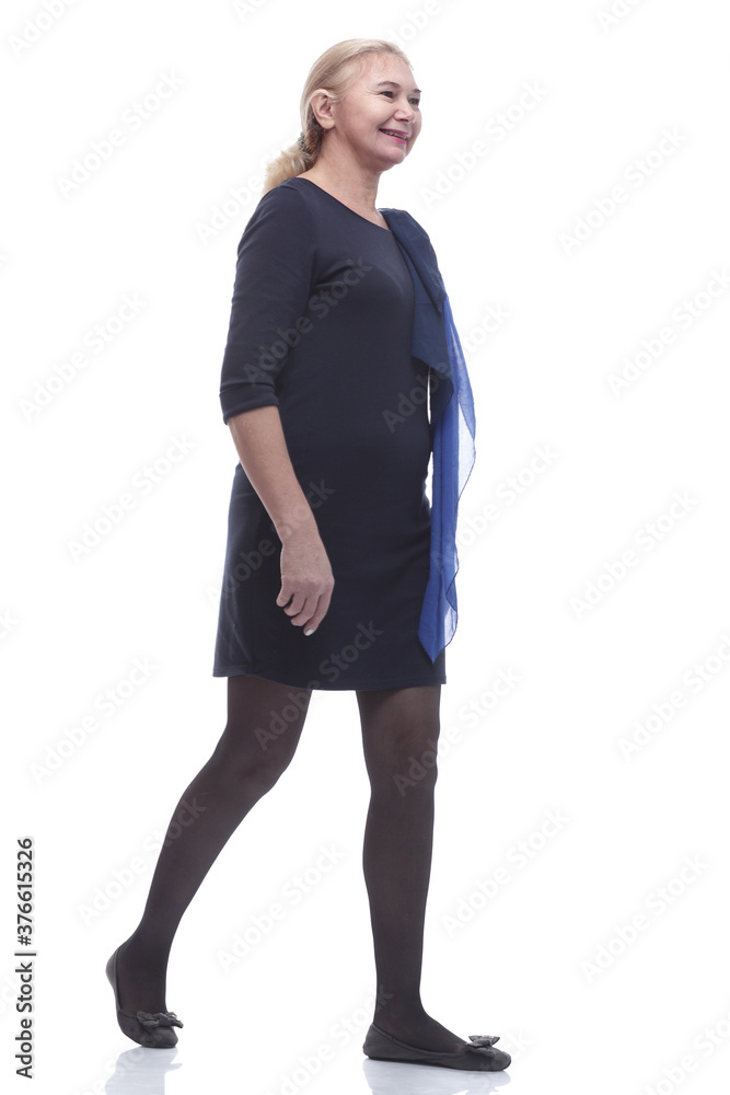 in full growth. happy mature woman stepping forward. in full growth. happy mature woman stepping forward.