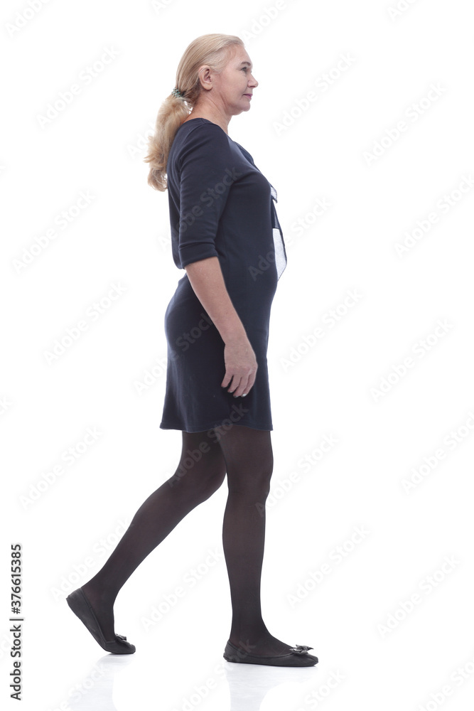 Fototapeta premium side view. confident mature woman stepping forward