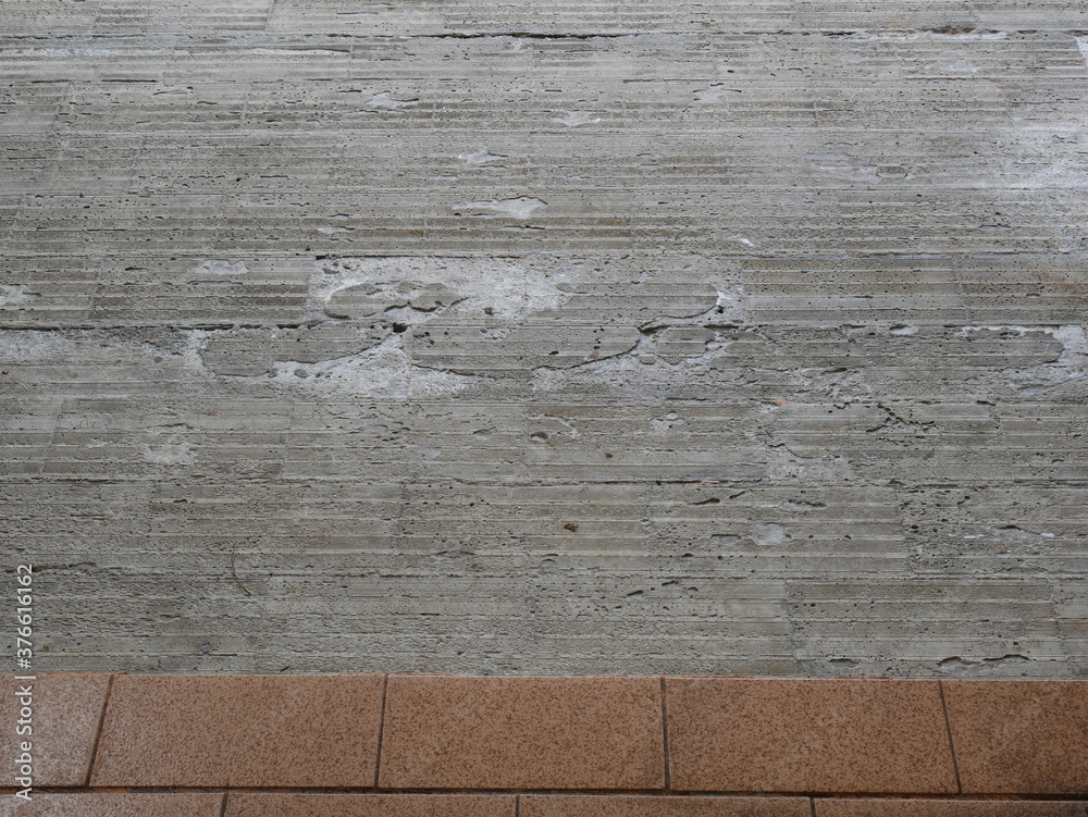 Broken and damaged asbestos tiles on the floor. Main effect from